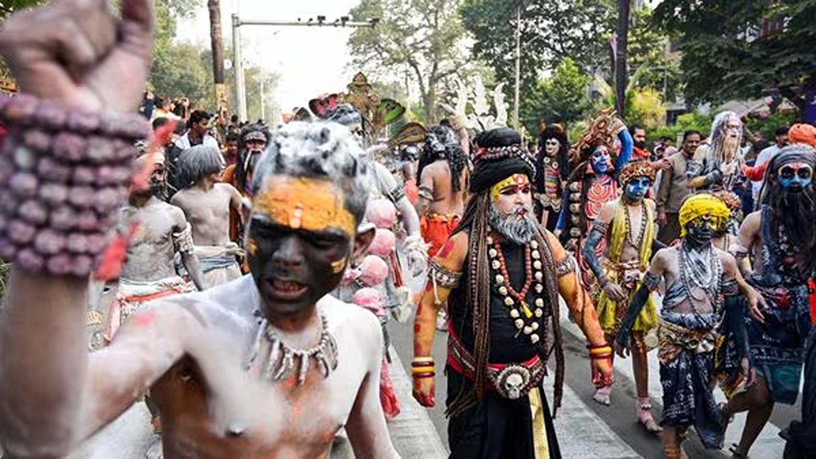 Artists perform during the 'Chavni Pravesh,' the royal entry procession for the Maha Kumbh Mela 2025, by the 'sadhus' of the 'Shri Panchayati Akhara Niranjani' in Prayagraj, Uttar Pradesh